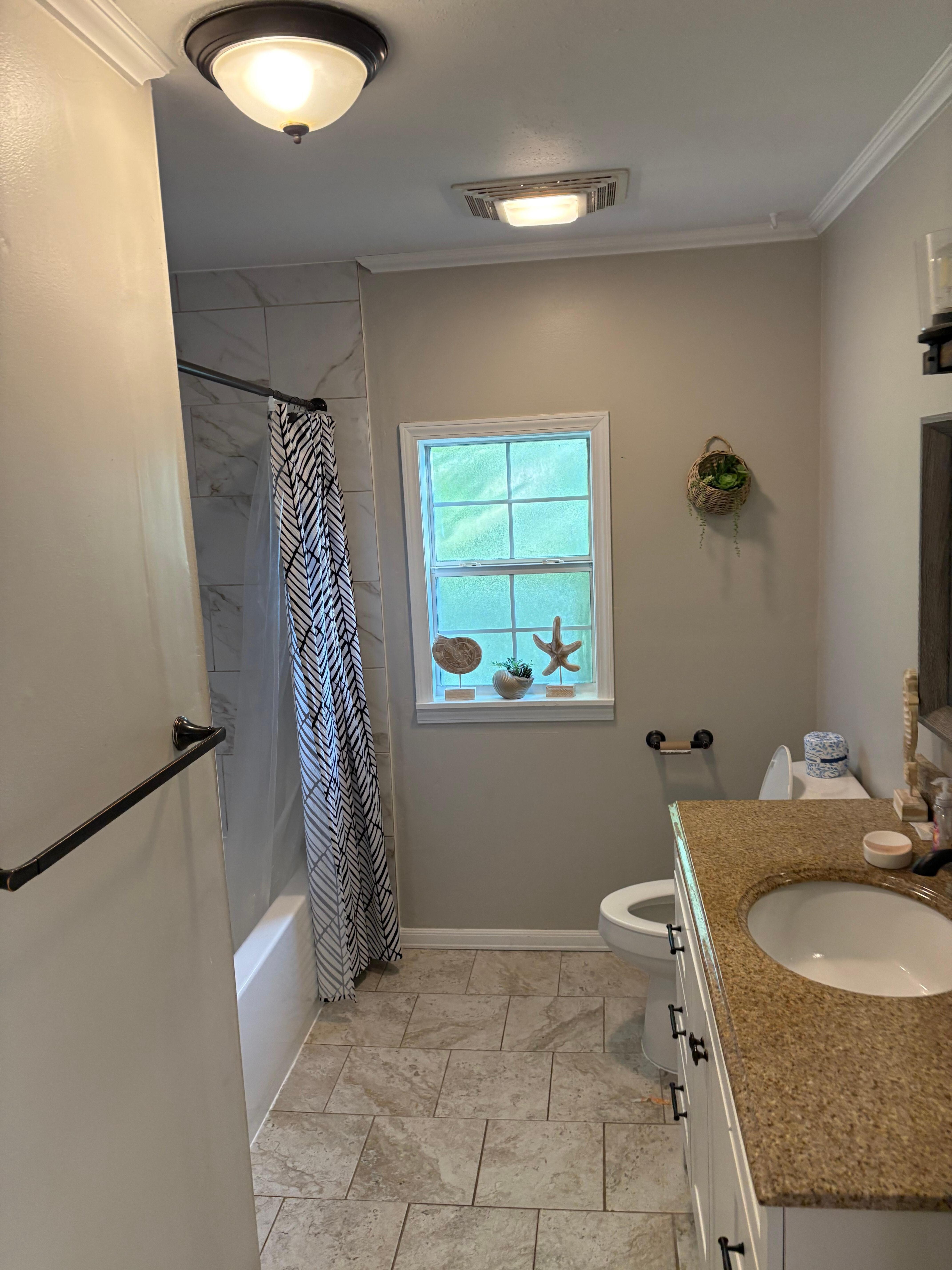 Restroom with bathtub that drains slowly 