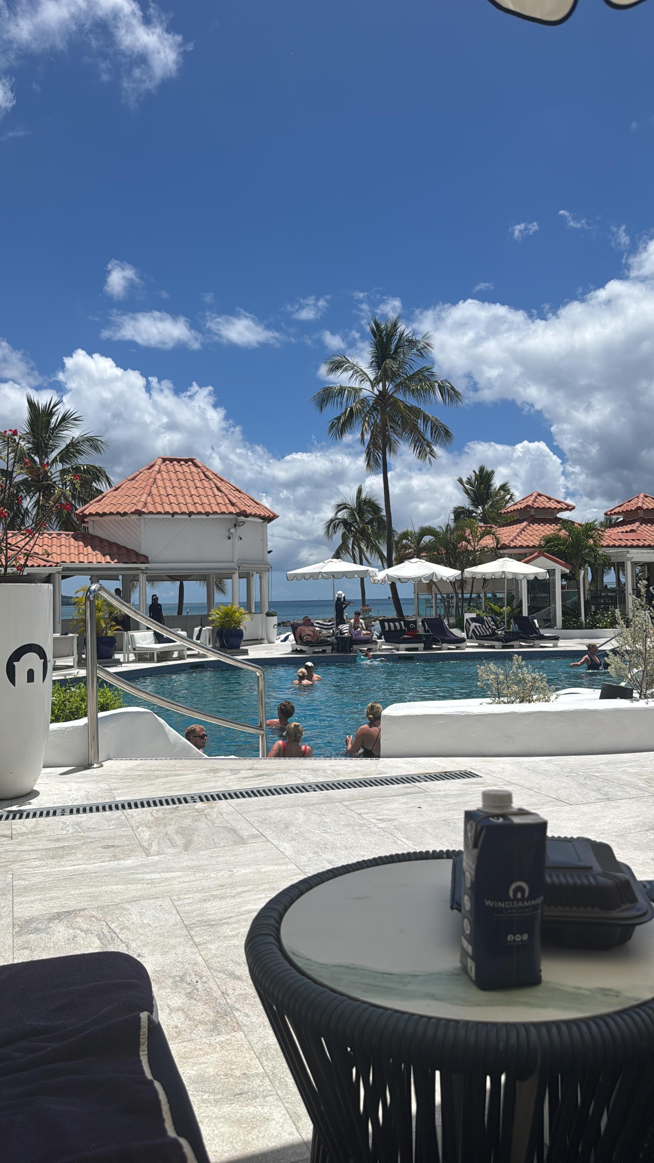 View of pool and beach access from sun lounger
