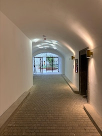 Directly inside the entrance, facing the inside courtyard