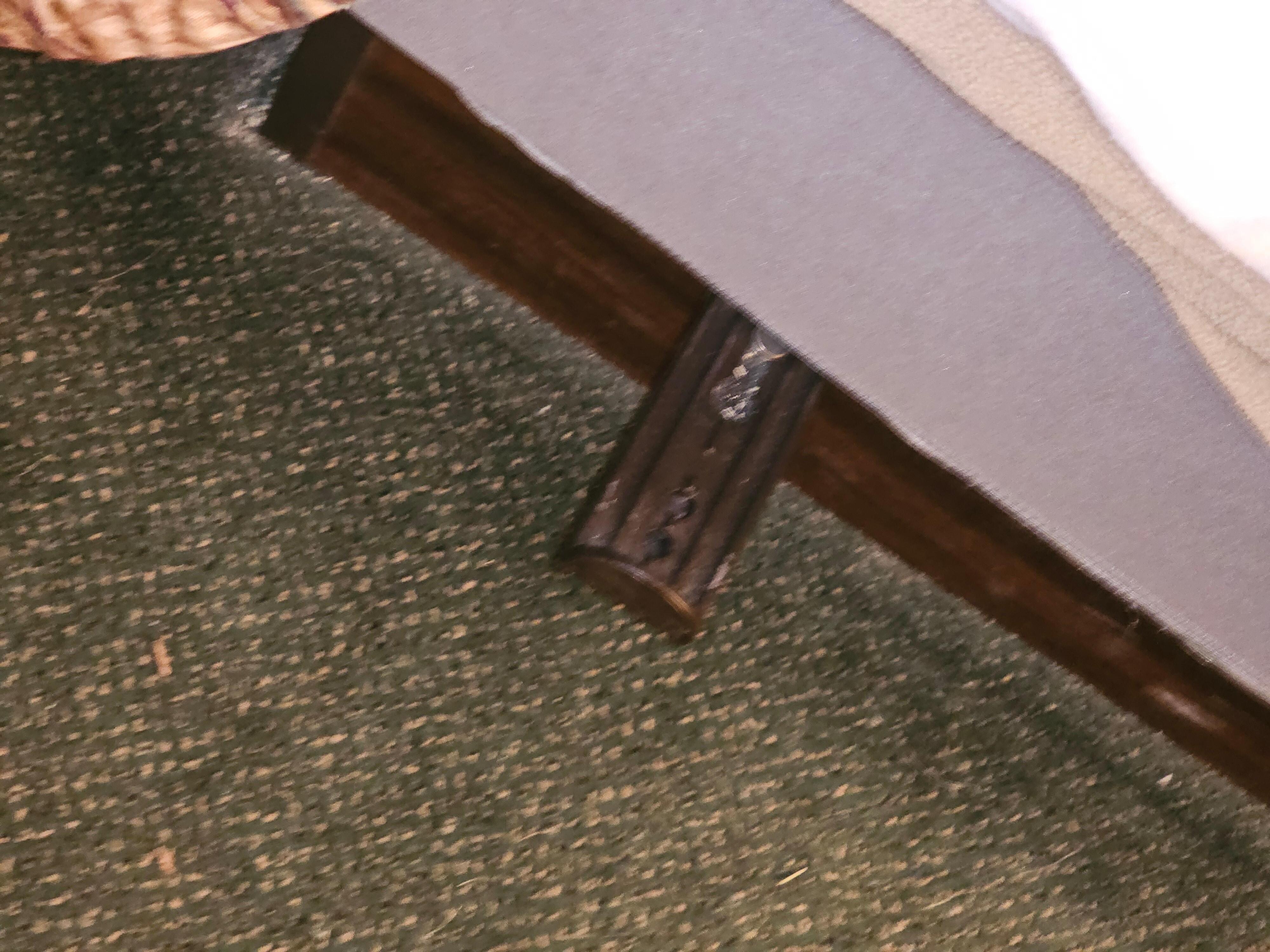 Steel bars projecting out from under bed.