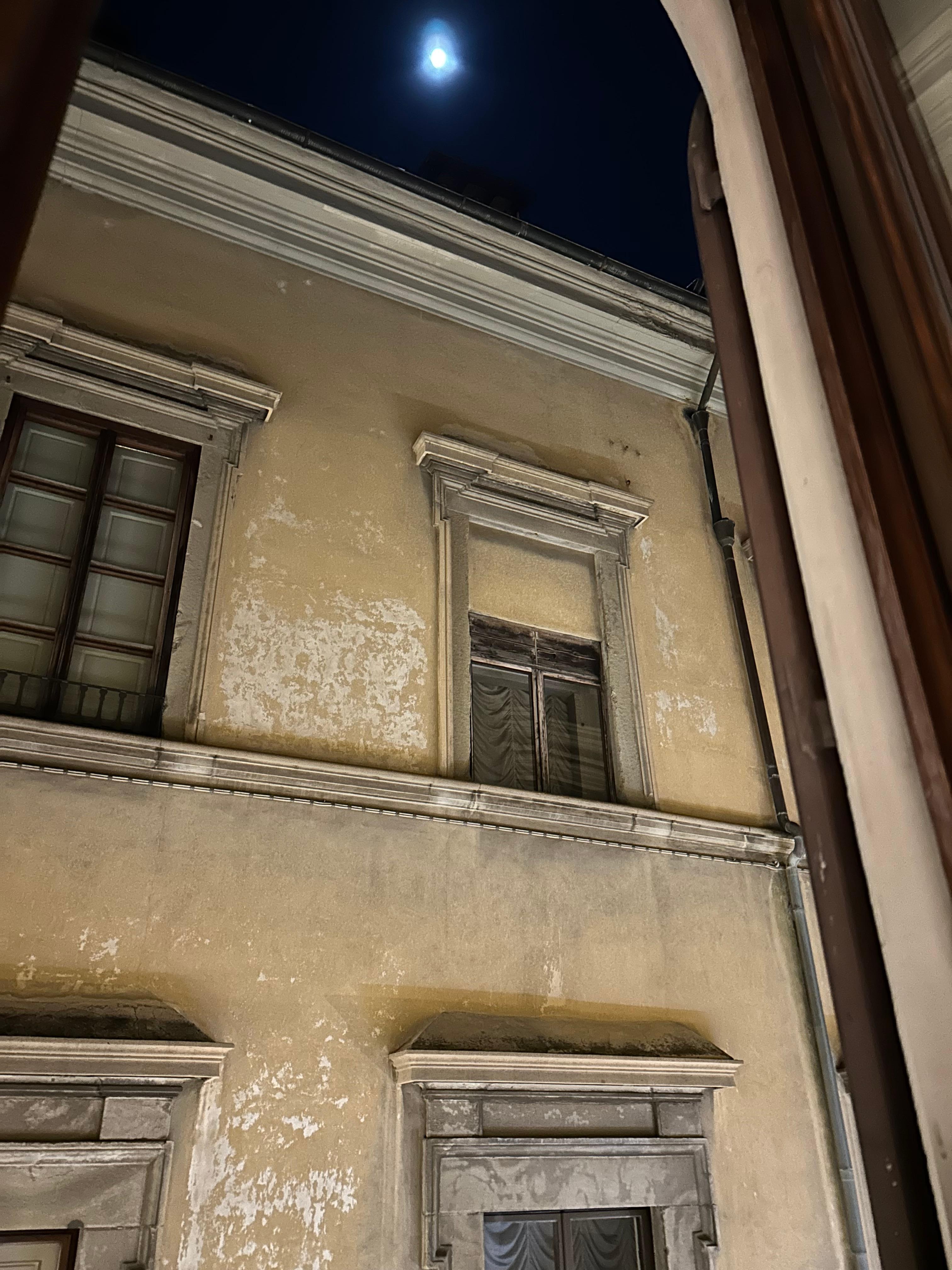 The apartment has some beautiful natural wood windows throughout. This was our view from the kitchen window on a full moon evening.