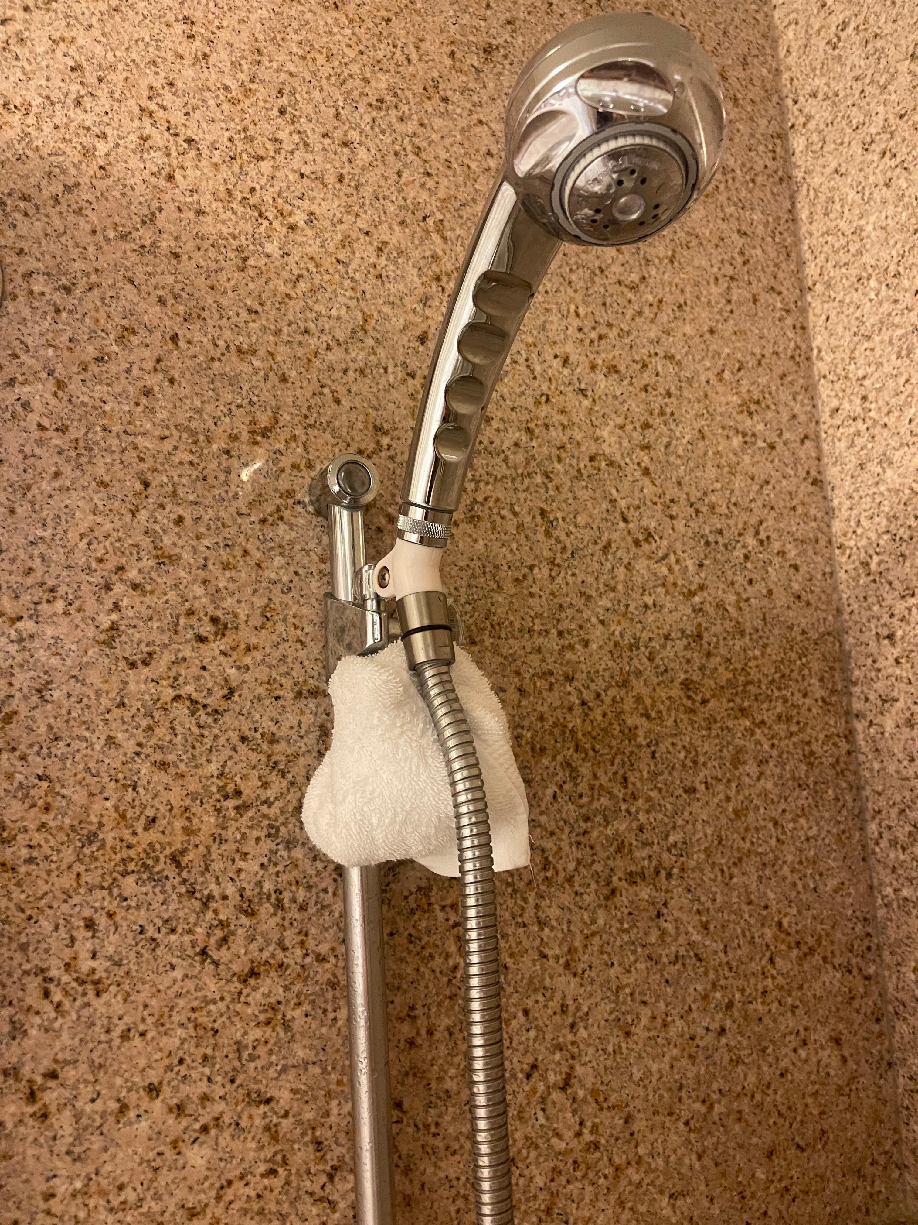 Because the situation was not corrected I just put a towel under the showerhead as you see in the picture thanks