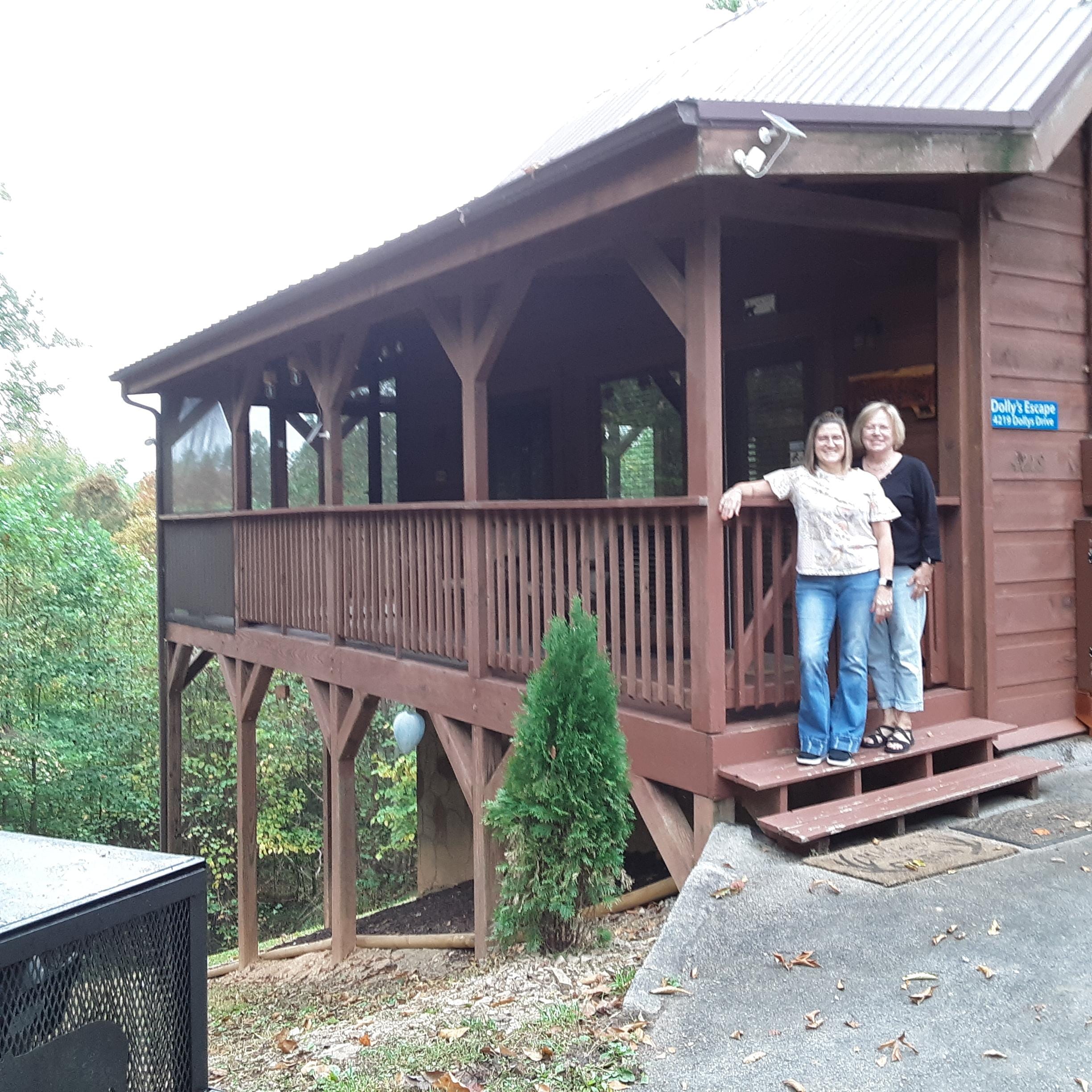 Friends outside cabin