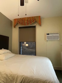 Small queen room with brick wall view