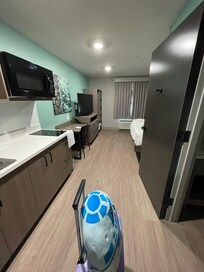 Big tv, even has a dresser and a few hangars and cubby area to put some stuff away.