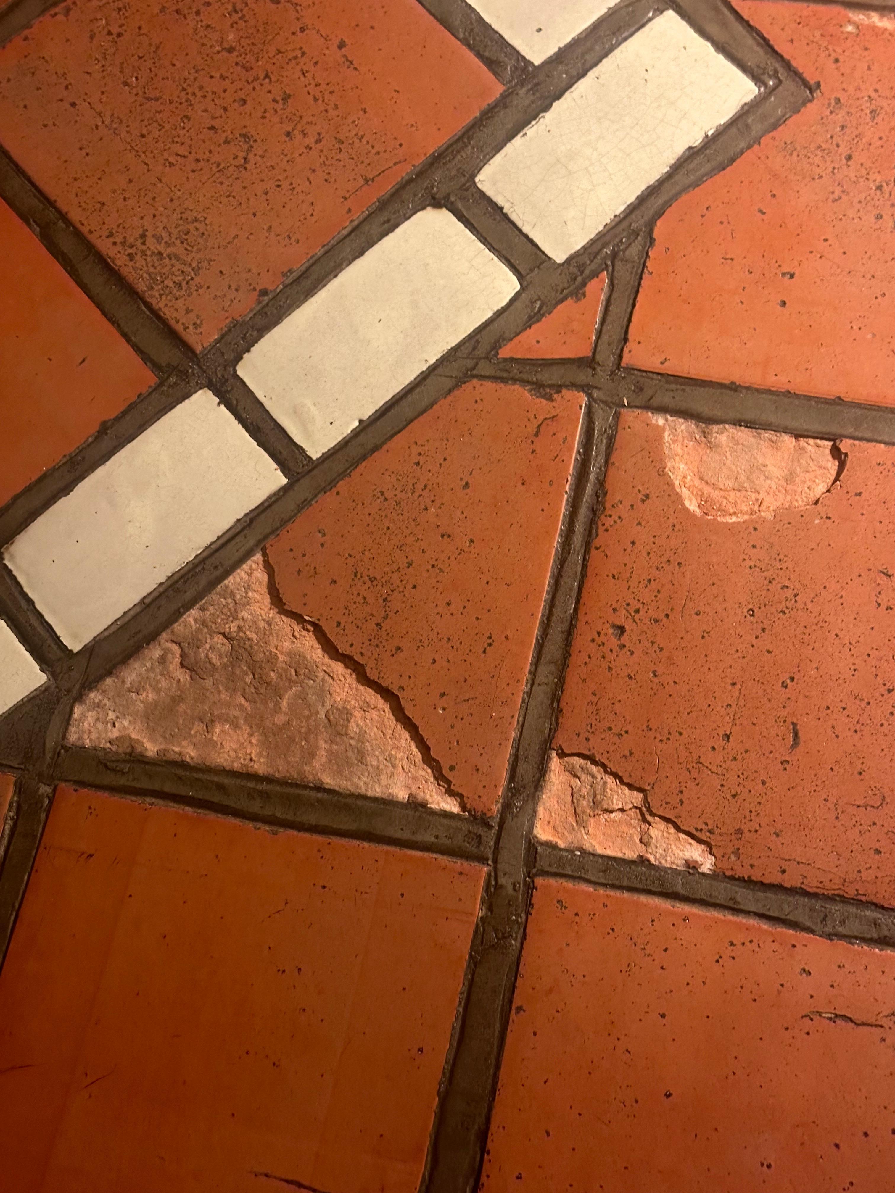 Broken floor tiles. 