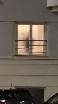 Outside view of the bathroom window at night.