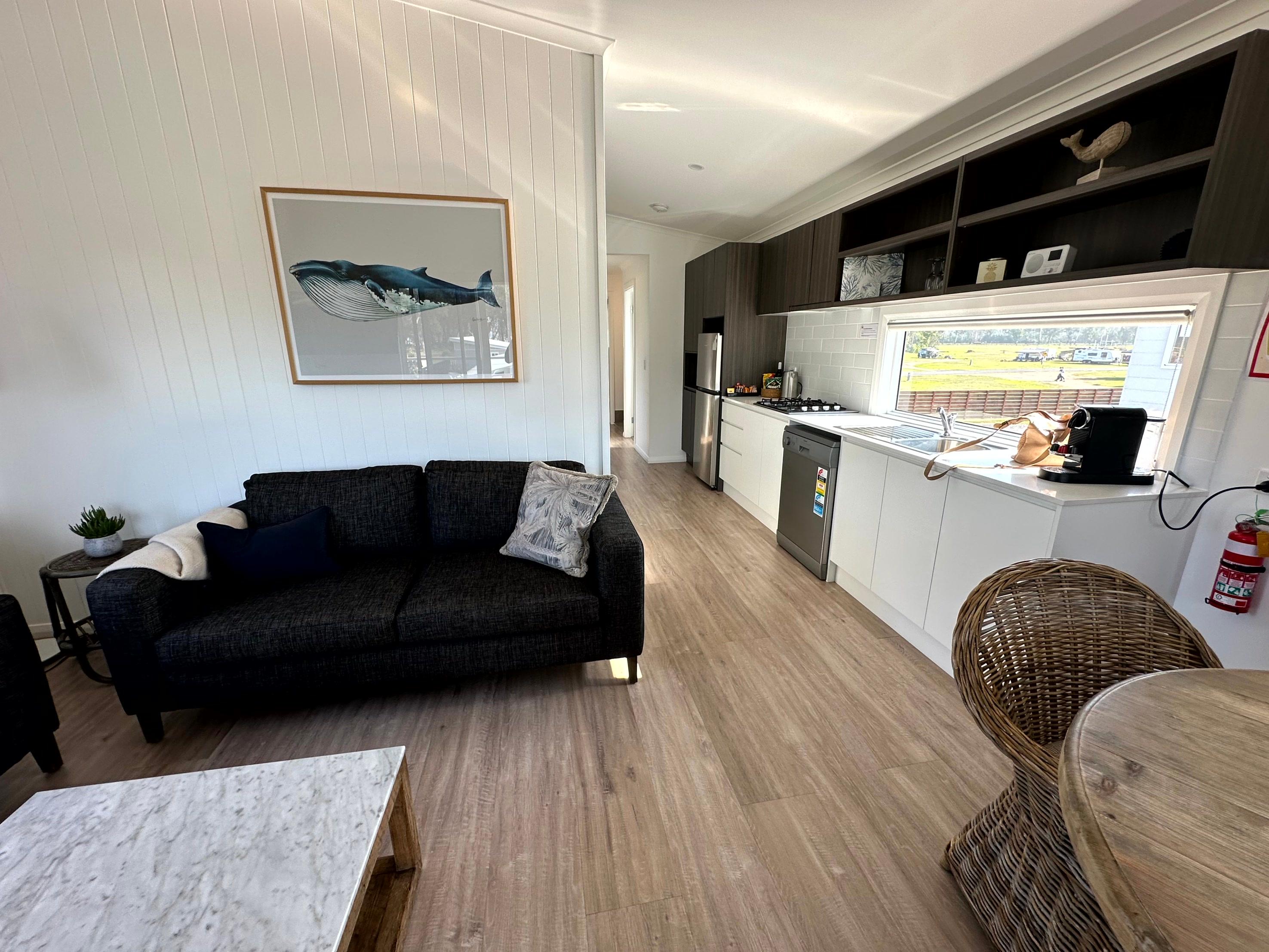 Living/dining room and kitchen in the two-bedroom, elevated villa
