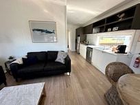 Living/dining room and kitchen in the two-bedroom, elevated villa