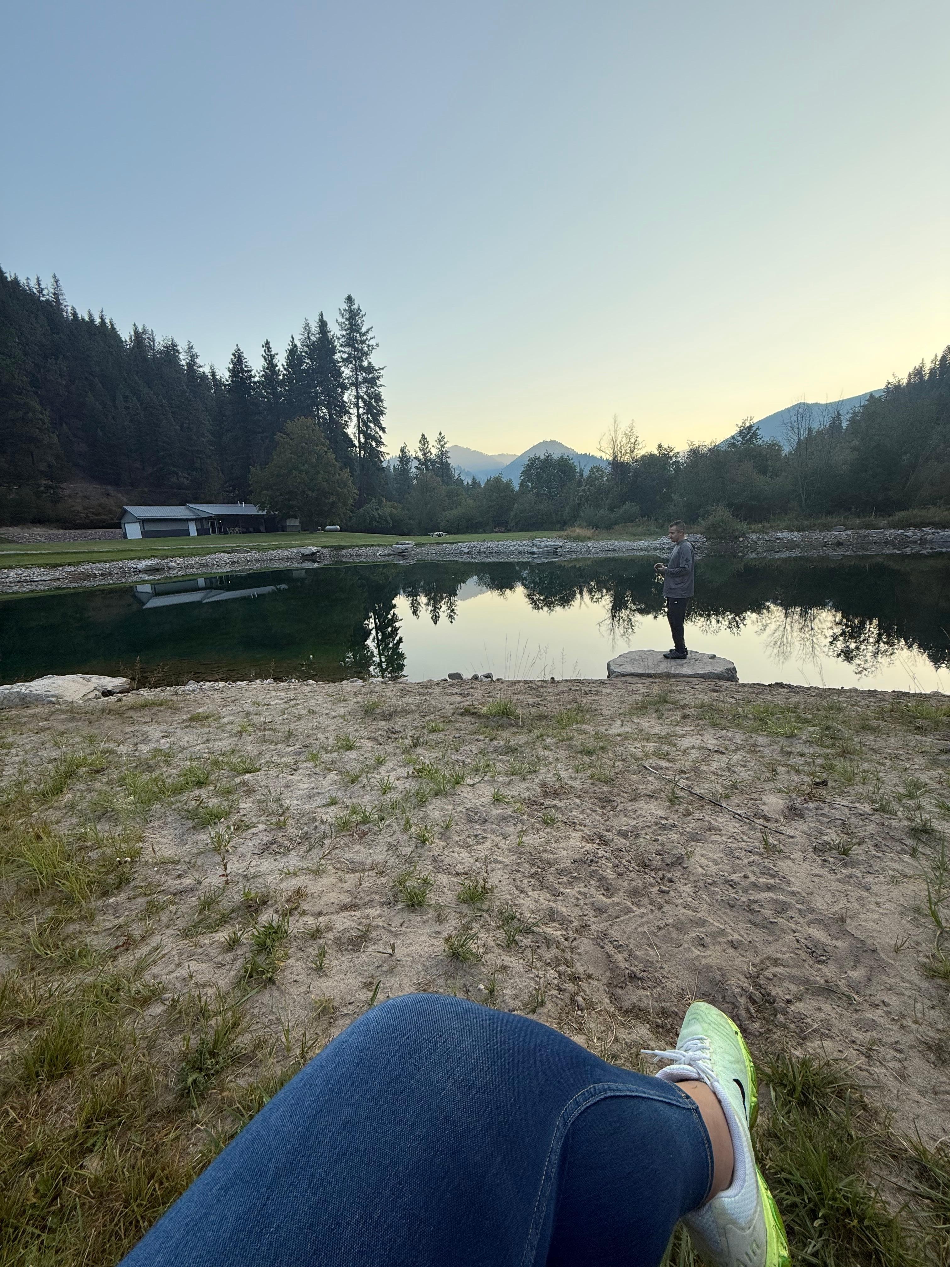 Sitting on the little bench by the pond. 
