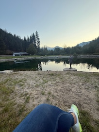 Sitting on the little bench by the pond.