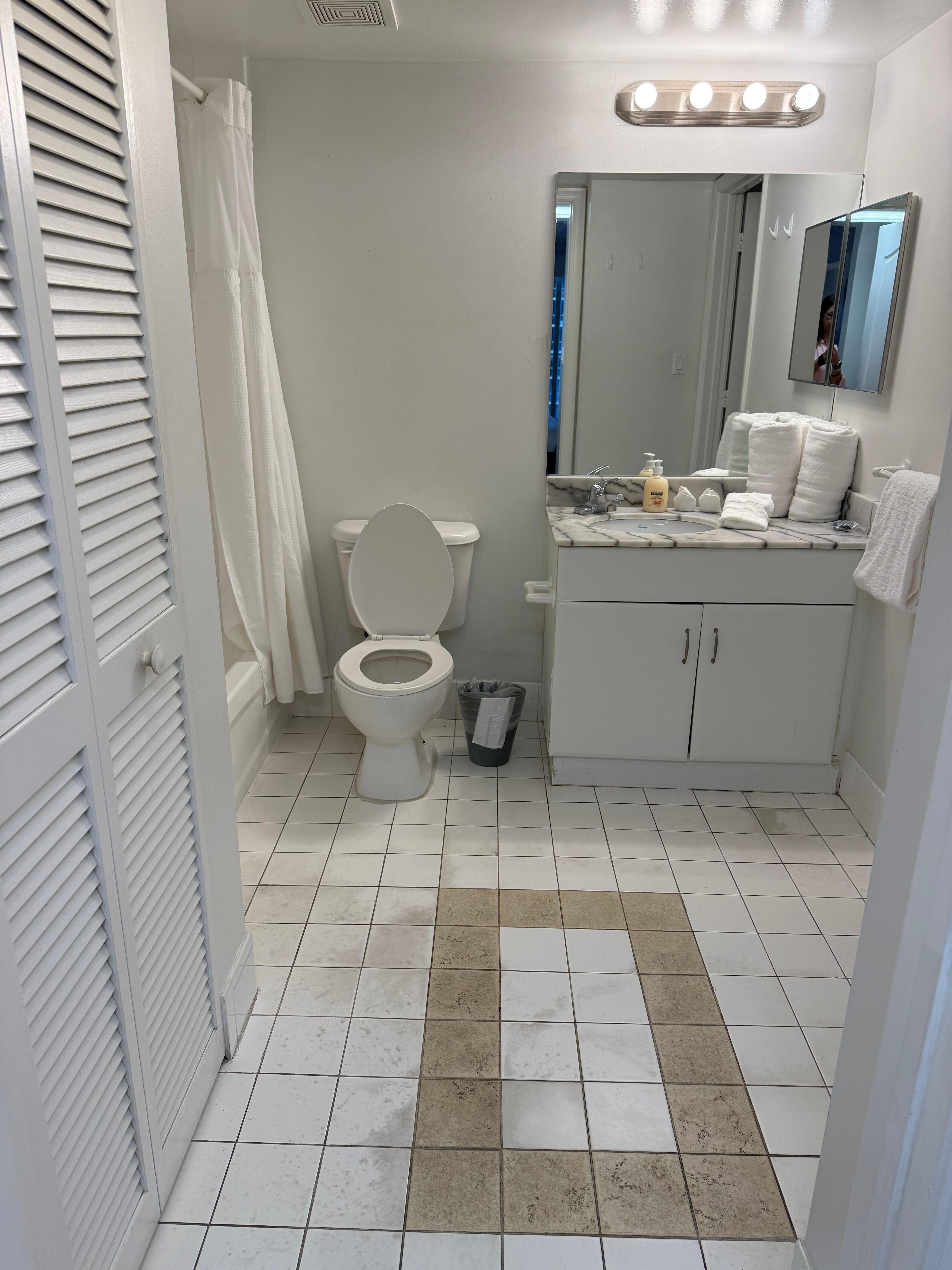 Bathroom- no toilet paper on holder or in unit upon arrival. Note dirty floor. 