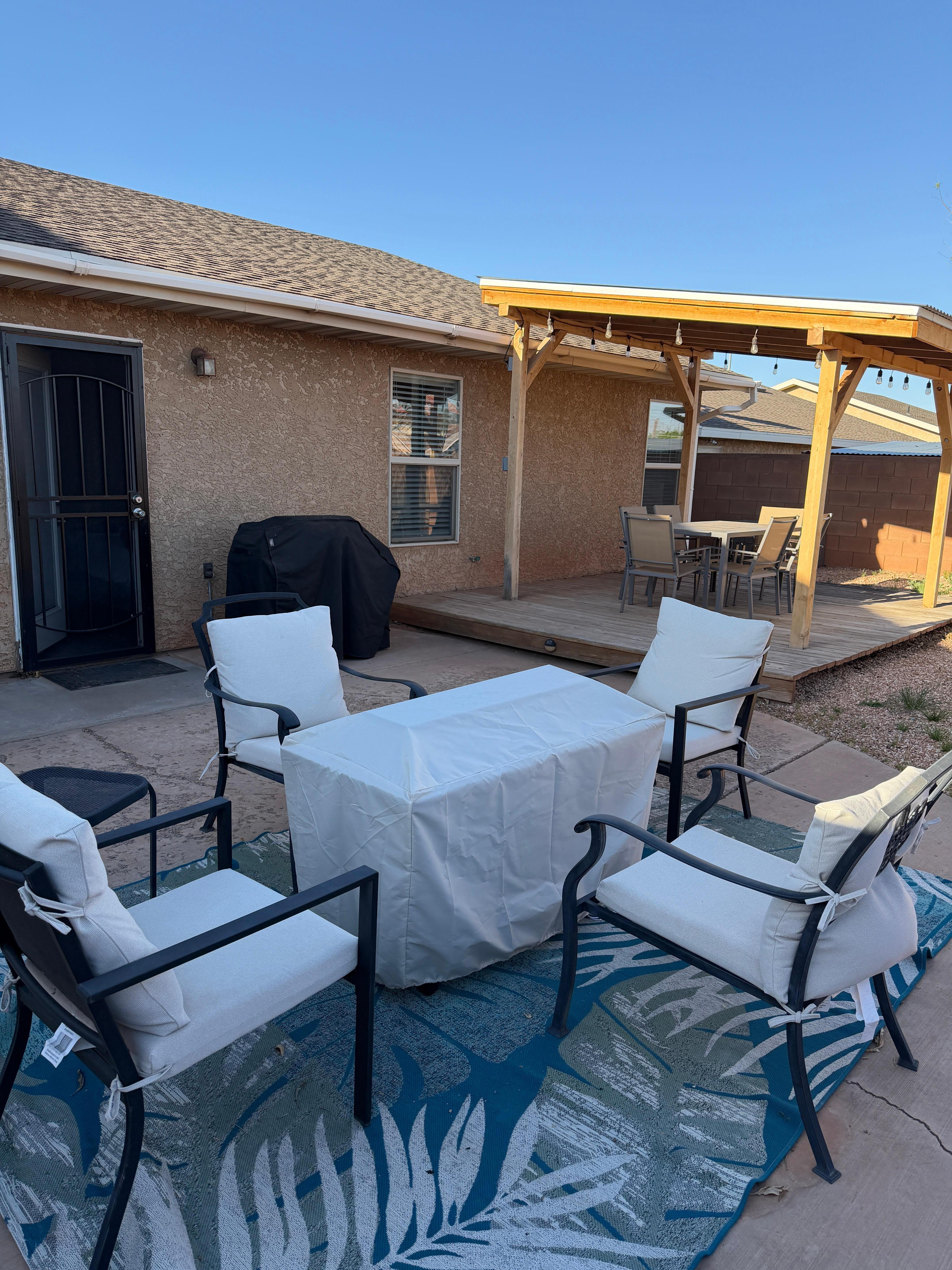 Backyard fire table, gas grill, raised & covered patio