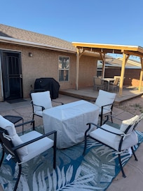 Backyard fire table, gas grill, raised & covered patio