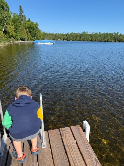 Checking out the clear water on the dock.  Visibility is nearly 15 feet down!