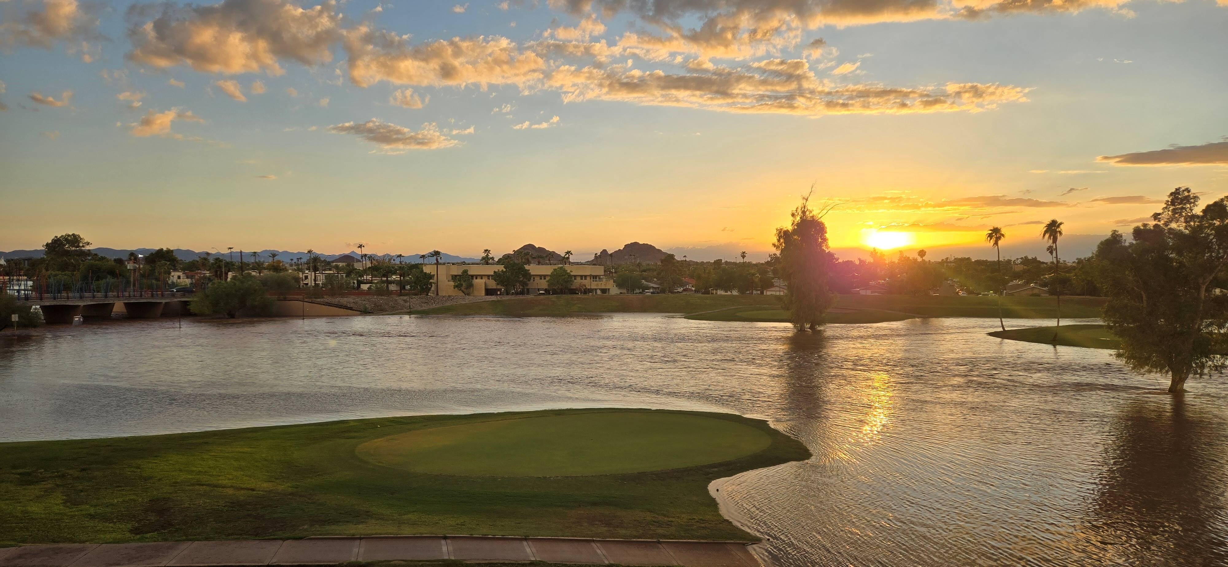 Sunset view from the balcony after a storm.  Golf course is flooded.