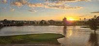 Sunset view from the balcony after a storm. Golf course is flooded.