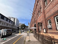 Front of hotel with valet drop off and small bar attached. Very small coffee shop at rear.