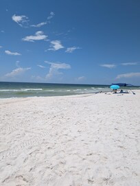 Beach across the street. It was not busy. We saw dolphins! There were also lots of fish while we were there.