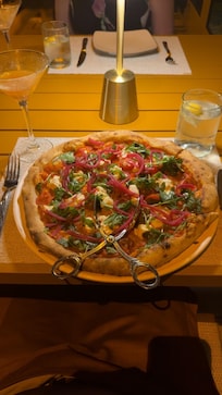 A pizza from Nolita made fresh in their pizza oven from scratch!