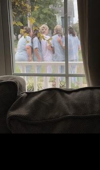 Bridesmaids taking photo's out front.
