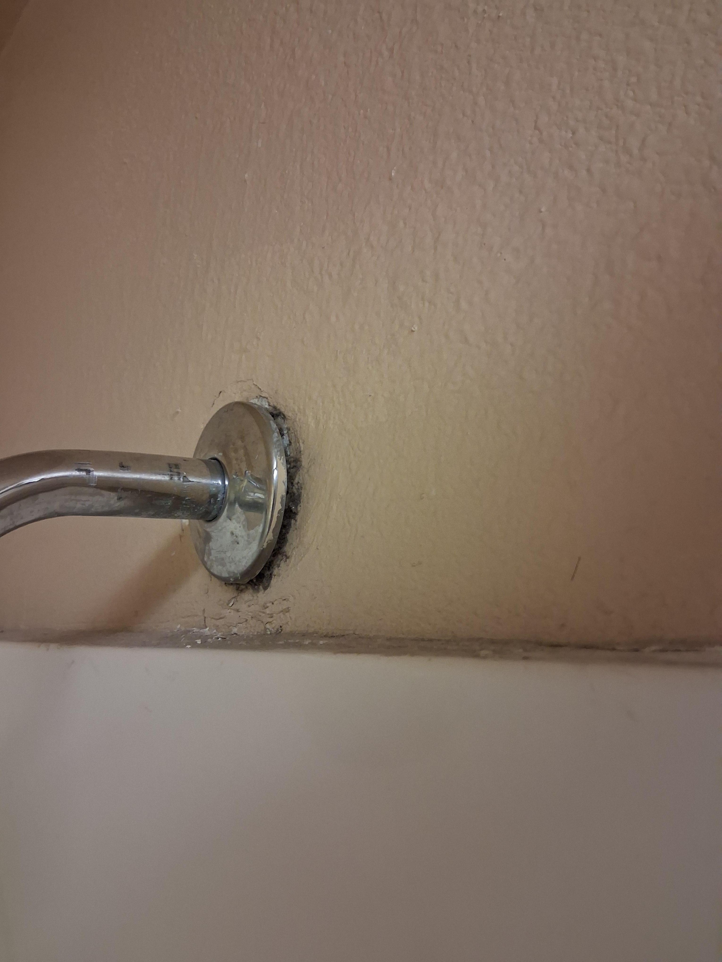 Shower head coming off wall.