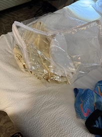 Cushions on the floor with no fitted sheet, hotel cushions are not clean, people should not be expected to sleep on them. One blanket, one sheet and one pillow for two sleepers on two make shift beds is not right