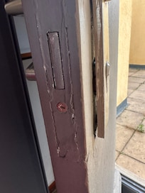 Door looked like it had been forced, a chunk fell out when first opened. Lock not fully installed.