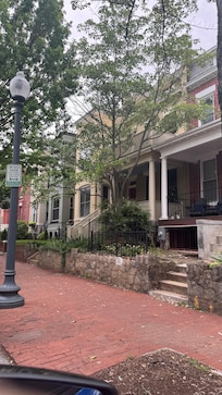 The apartment is in the basement. Go to the yellow home up the stone steps and then down to the apartment.