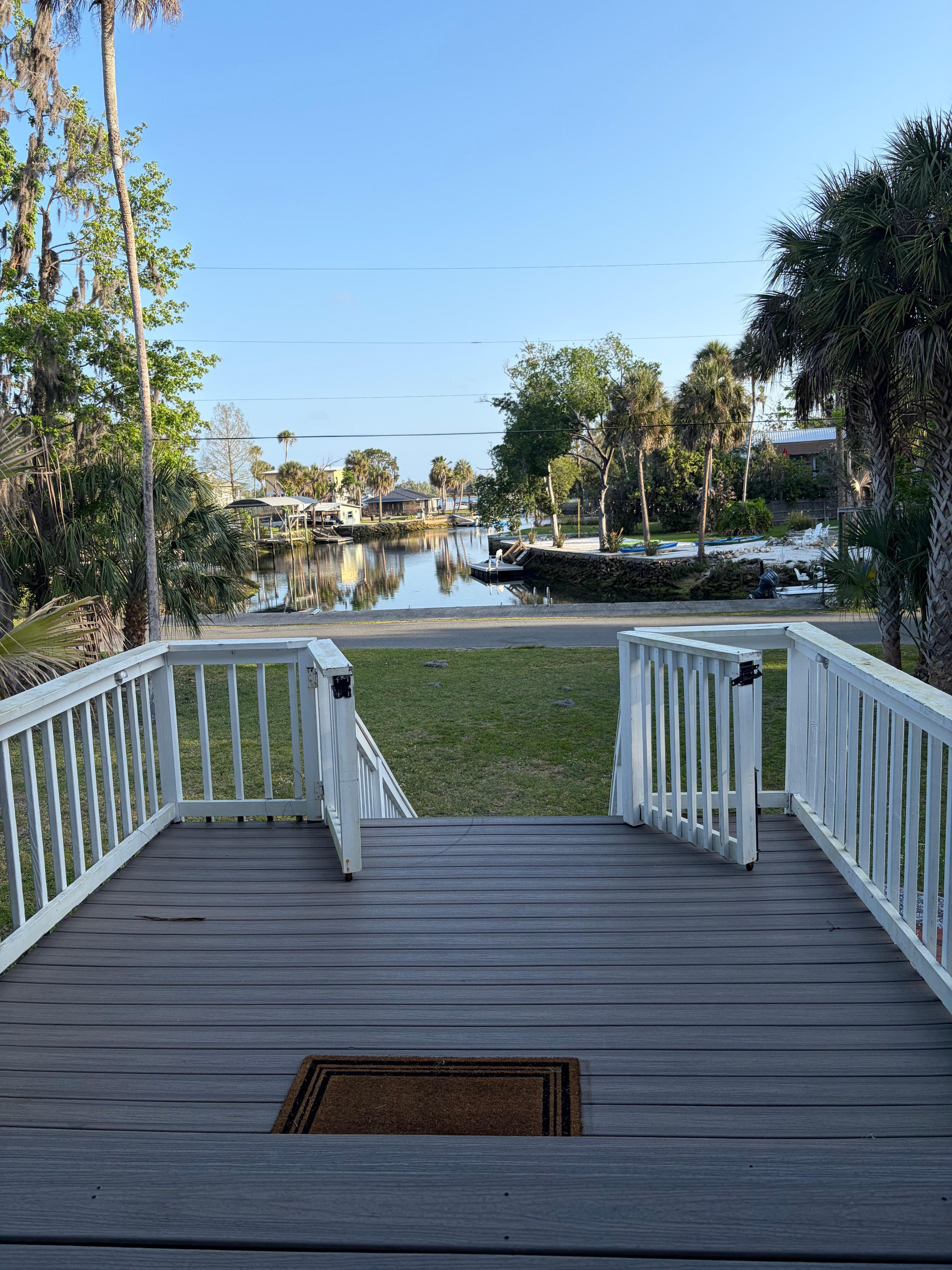 Front porch sitting in rocking chair drinking coffee and looking at the water