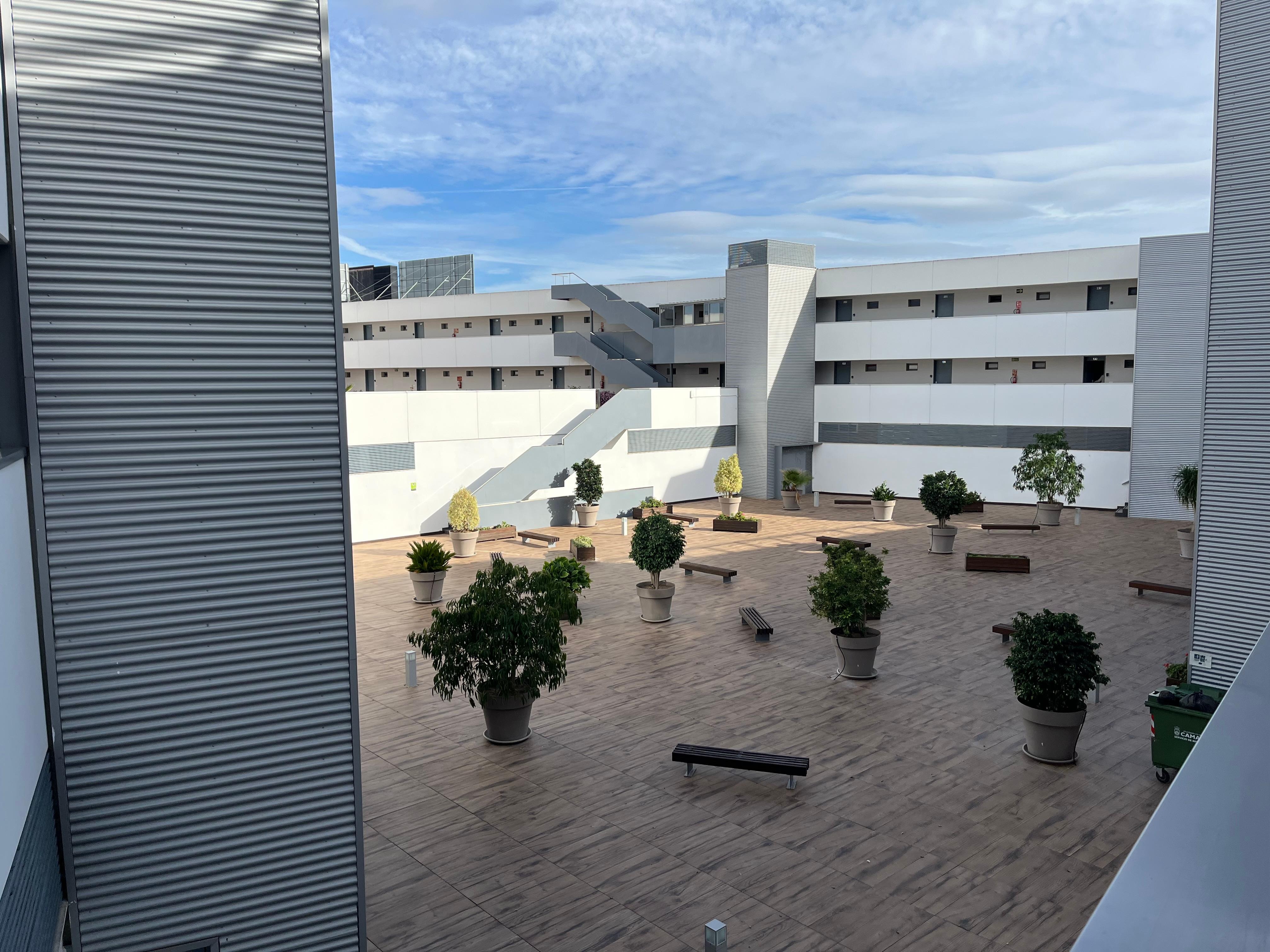 Overlooking the courtyard area from 1st floor balcony. All doors go to an outside hallway