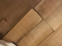 Floor lifting due to the water in front of the bathroom