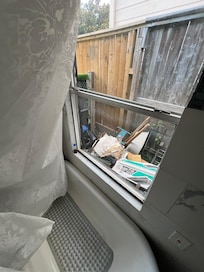 Junk yard and no privacy outside master tub