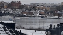 Amazing view of the frozen Archipelago from the hotel room. People enjoy skiing on the frozen lake.