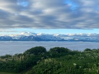 Early morning above the low lying clouds over the bay