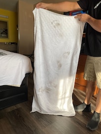 Walking from the bathroom to the baggage area after showering to keep feet clean.