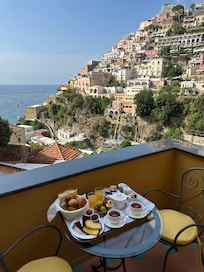 Balcony with view of town and sea