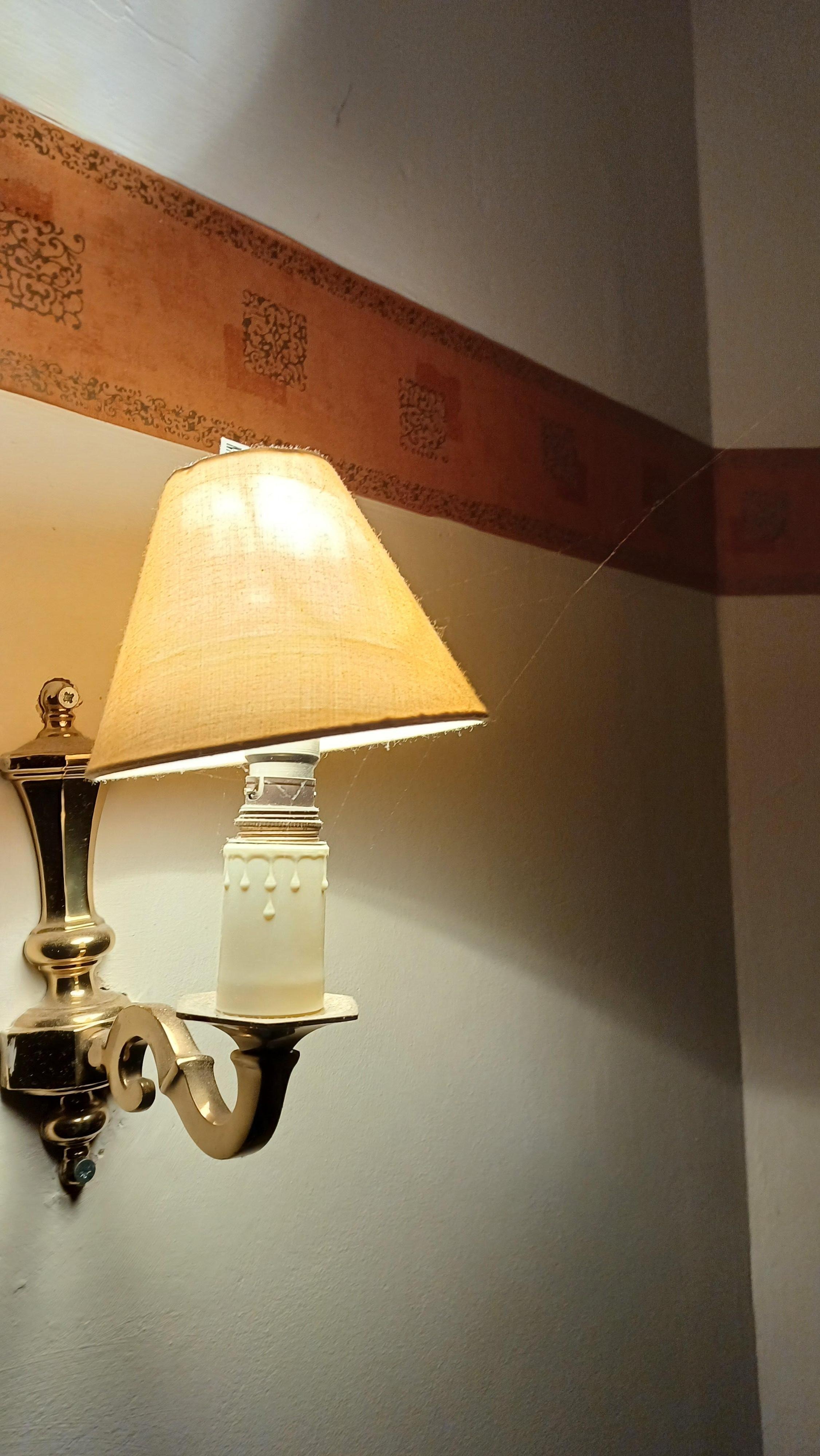 Cob webs and dust on wall lamps