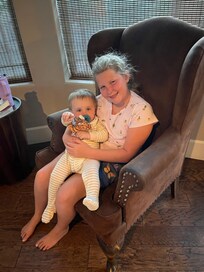 Cousin hugging her baby cousin