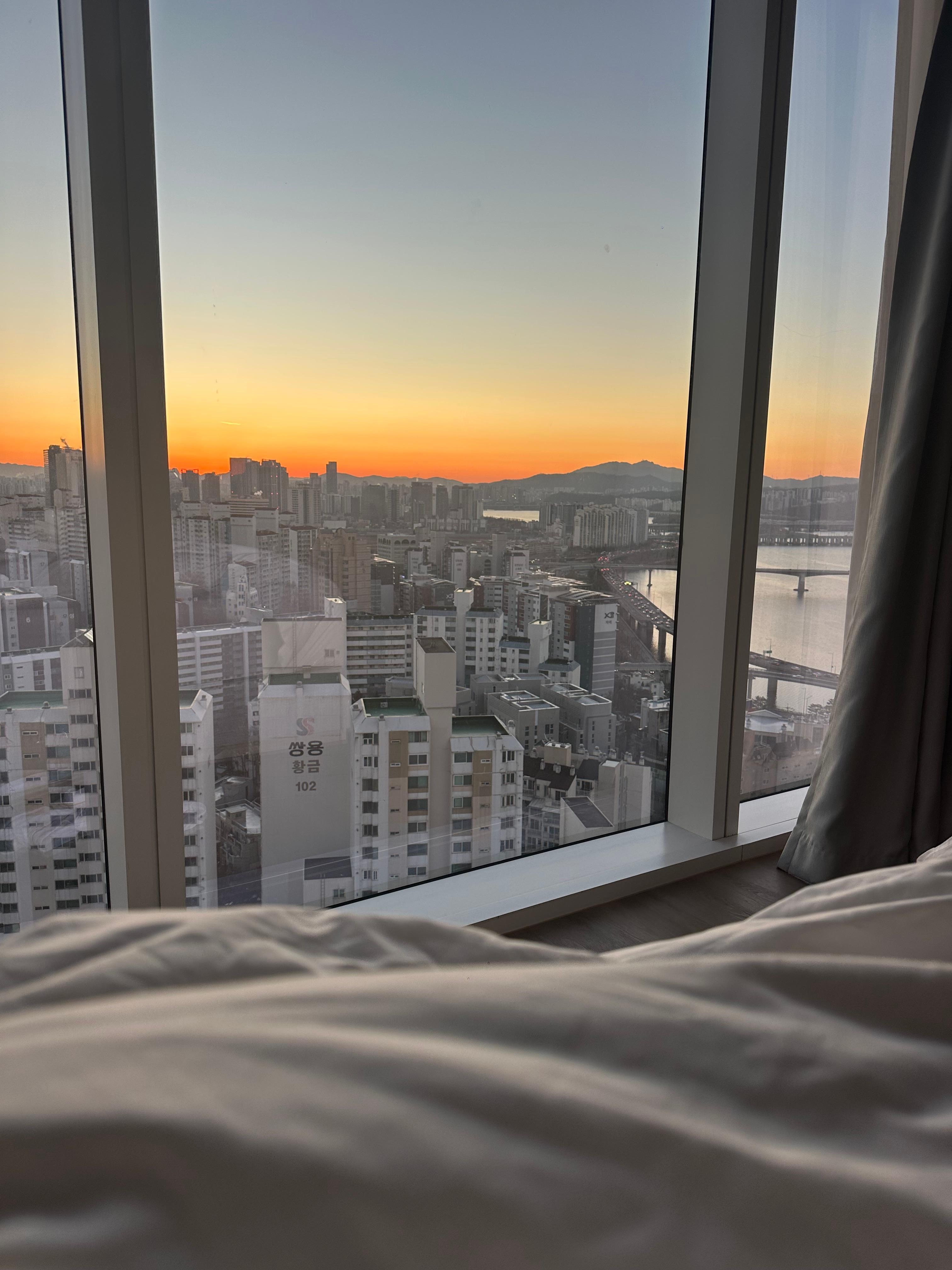 View from our bed, beautiful sunrise and sunset and view of the city 