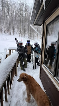 The crew headed out the walkway to the slopes.