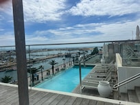 Rooftop pool with great views and a bar. Even 2 large beds with canopy.