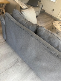 Visibly broken couch. Worn out and dirty.