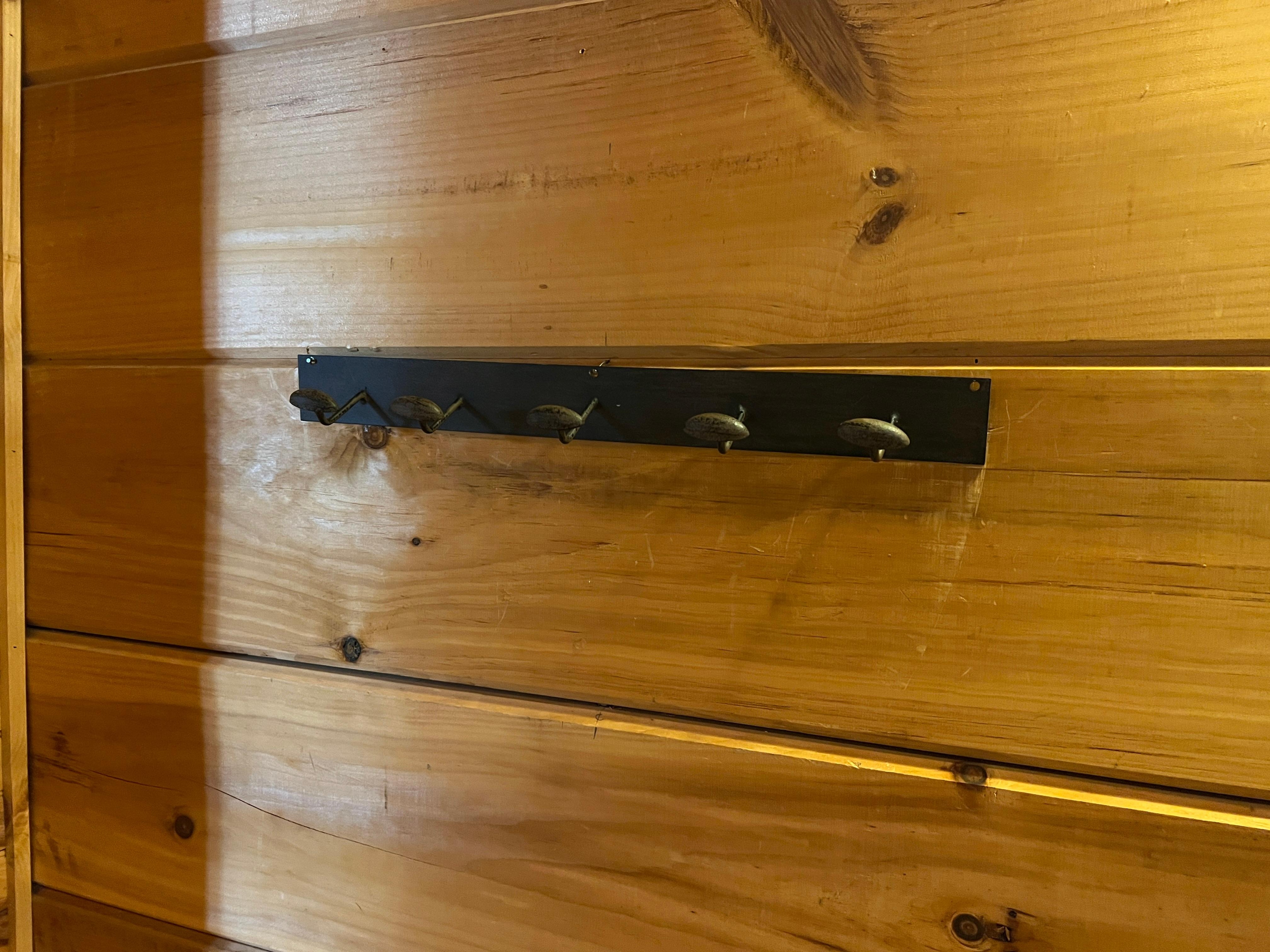 Coat held barley by tiny nails