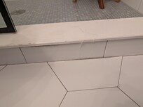 Water running out of shower onto bathroom floor