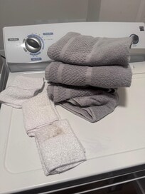 Towels, tattered washcloths and a stained washcloth.