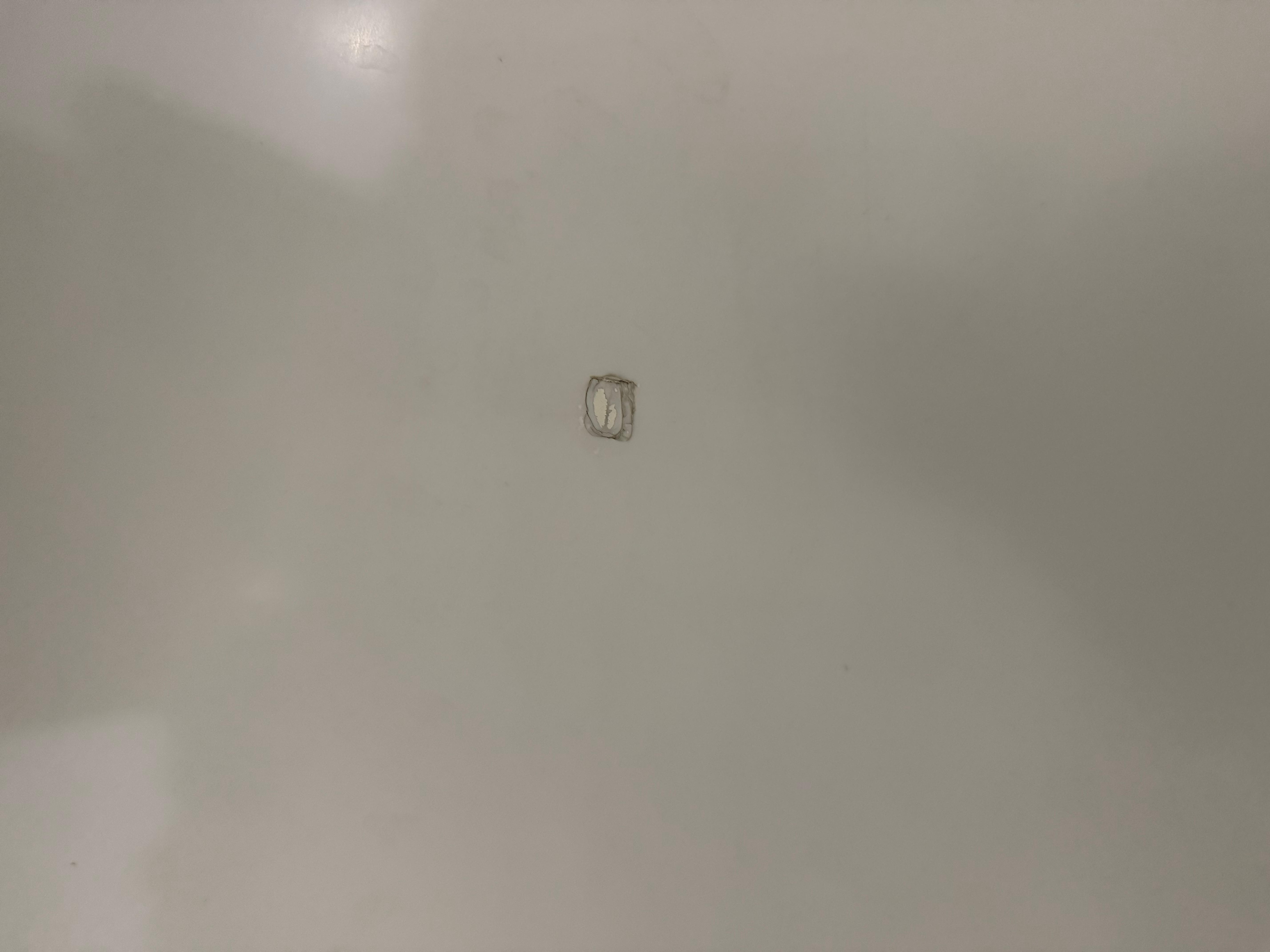 Hole in bath repaired and glued 