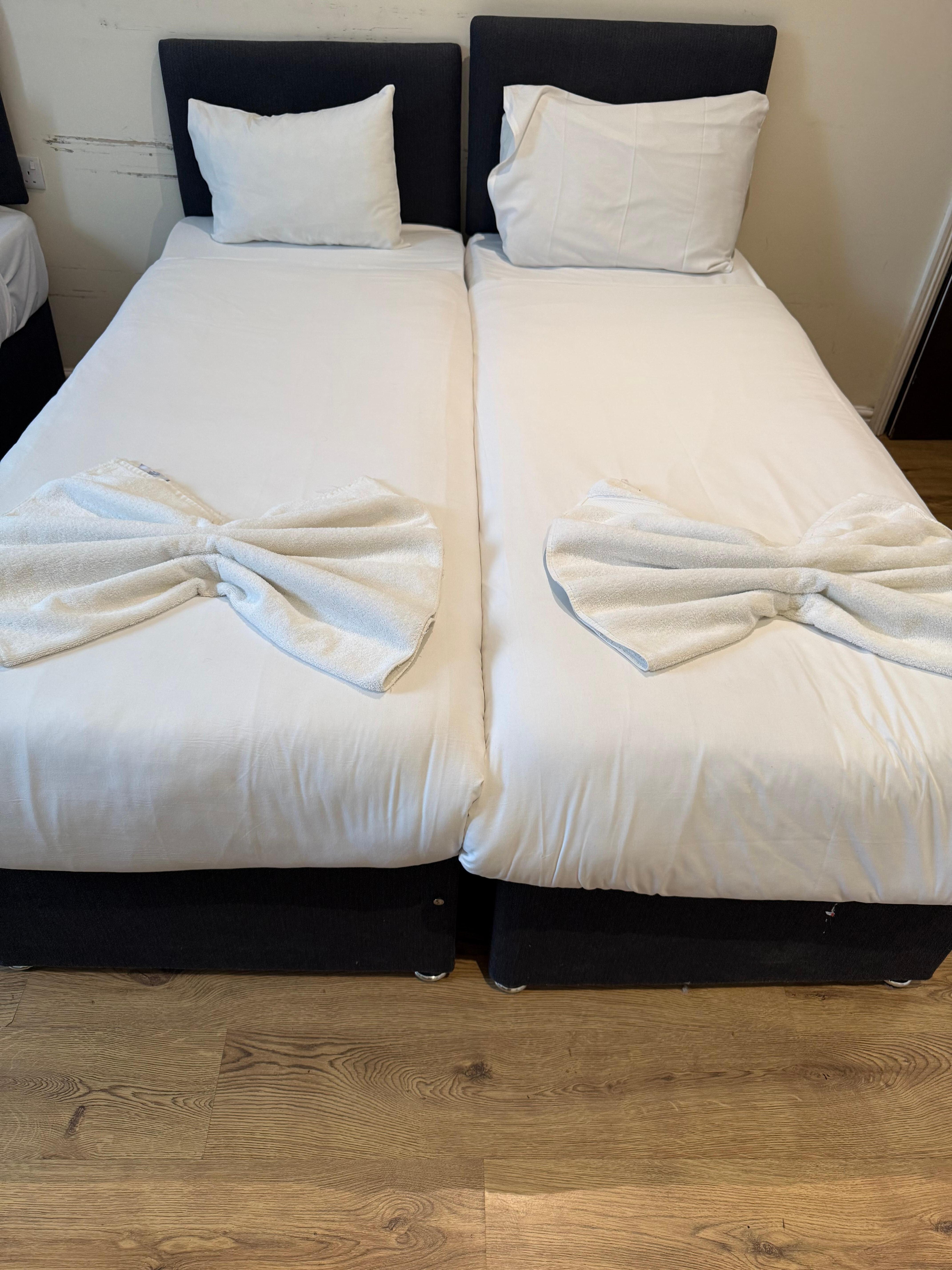 I liked how they put the towels like a bow at the end of the bed. 