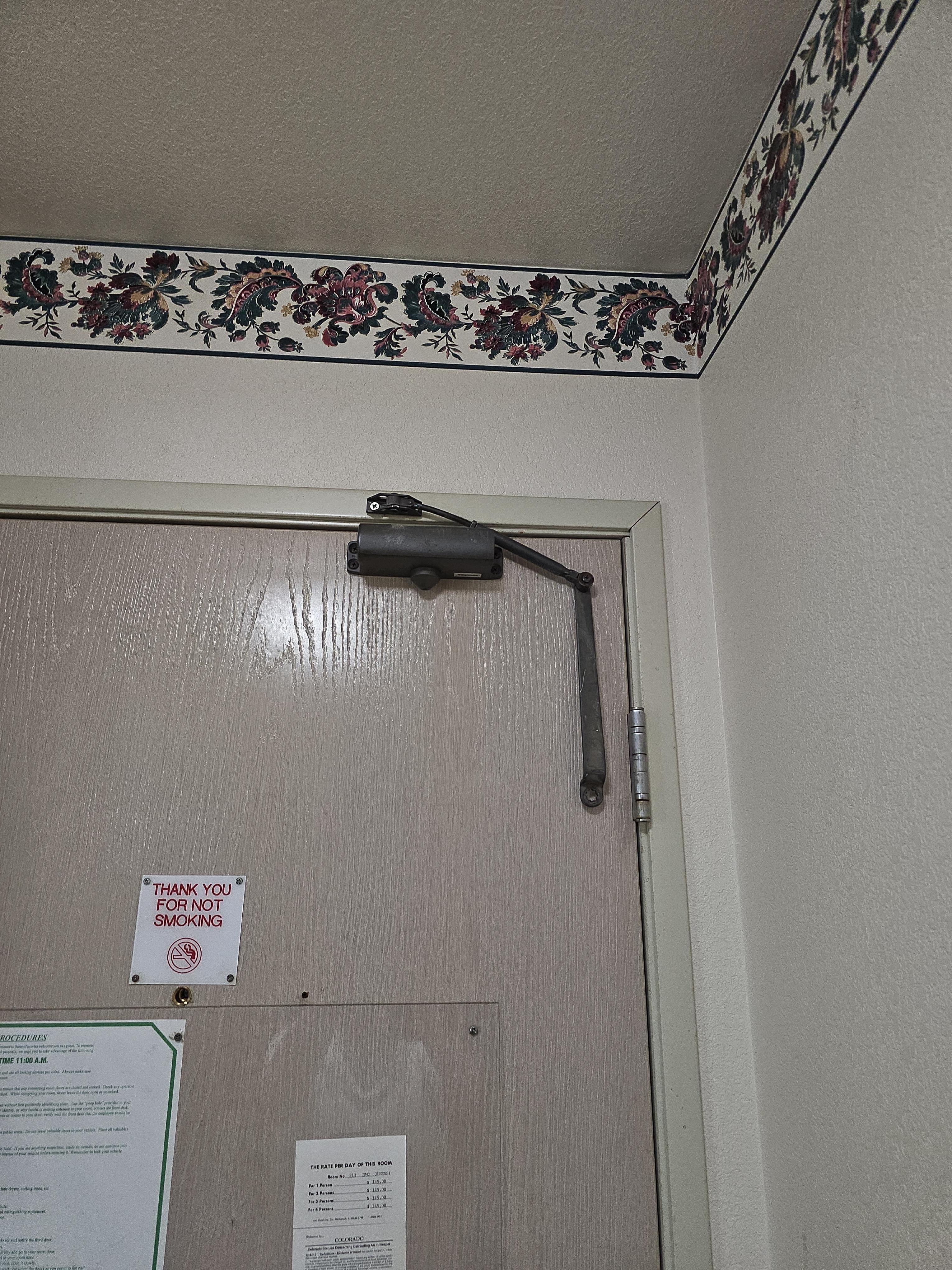 Automatic door closer was hanging loose
