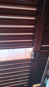 More damaged shutters at areas where door handles are located